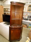 A dark wood stained corner cupboard with open shelving Height 183cm, width 66cm,