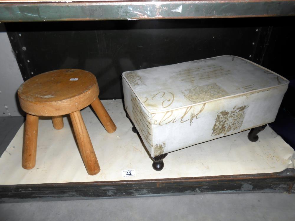 A small oak milking stool and a fabric covered stool (would need cleaning or re-covering)