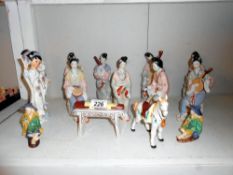 An 8 piece Geisha band plus other figures etc.