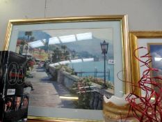 A gilt framed and glazed print of a European coast scene