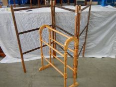 An old clothes horse and a modern towel rail.