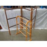 An old clothes horse and a modern towel rail.