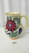 An art deco 1930's jug vase, Wardles Swansea Ware tube lined lustre ware flora, 22 cm (9").