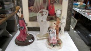 A figural table lamp and 3 figures.