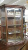 A glazed cabinet signed Asprey Jewellers.