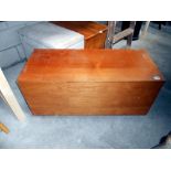 A teak blanket box on castors 100 x 43 x 46 cm