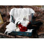 A case of assorted linen in vintage suitcase