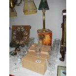 4 sets of 6 glasses and a candle lamp.