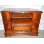 A mahogany effect TV/DVD unit.