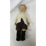 A vintage felt boy doll, 42 cm.