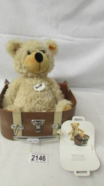 A Steiff 'Charley' bear with suitcase.