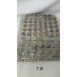 23 sleeves of assorted foreign coins, in excess of 1000 coins in total.