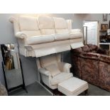 A cream suite with 3 seater settee,