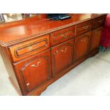 A Rossmore dark wood stained sideboard, 4 doors, 3 drawers,