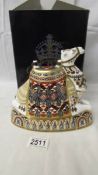 A Royal Crown Derby camel paperweight with silver stopper and in original box.