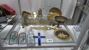 A mixed lot including horse brasses, light catchers etc.