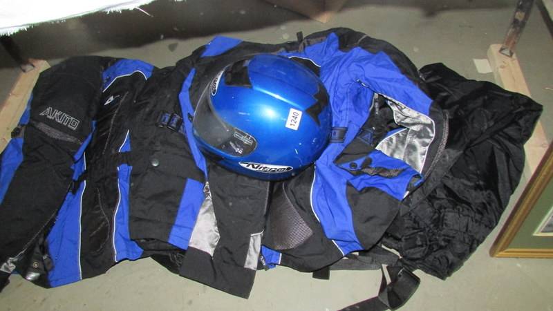 A quantity of motorcycle outfits including full face crash helmet.