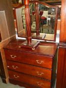 A three drawer mahogany dressing table.