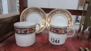 Two Royal Crown Derby Chardonay pattern coffee cans and saucers.
