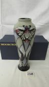 A boxed Moorcroft Peacocks on Parade trial vase.