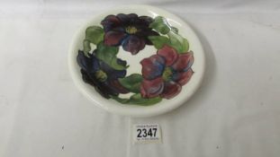A signed Moorcroft plate. ****Condition report**** Undamaged.