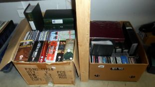 A small quantity of dvd's and cd's and a large number of albums with dvd's and cd's (no boxes for