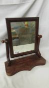 A Victorian mahogany toilet mirror, overall height 37 cm, mirror 29 x 24 cm.