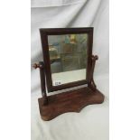 A Victorian mahogany toilet mirror, overall height 37 cm, mirror 29 x 24 cm.