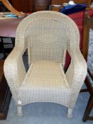 A large loom wing arm chair