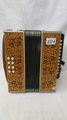 A vintage accordion with original AMII tag.