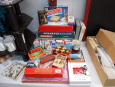 A selection of vintage playing cards and board games, including Scrabble etc.