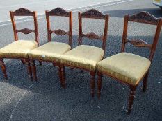 4 cushioned oak carved chairs
