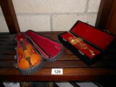 A miniature violin and trumpet,