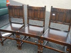 A good set of 4 oak hard seated chairs (including 1 carver)