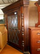 A solid pine dark stained corner cupboard with leaded glass door 72cm x 37cm x height 79cm