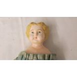 A 19th century papier mache' doll, in good condition for age, 35 cm.