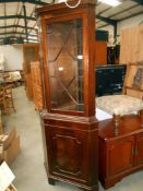 A mahogany corner cupboard with astragal glazed door, 54.