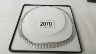 A good quality white metal necklace, stamped 835.