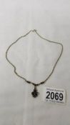 A necklace set garnets marked 825?, chain stamped 8309.