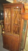 A mahogany astragal glazed freestanding corner cabinet.