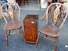 A pair of wheelback chairs & a bedside cabinet