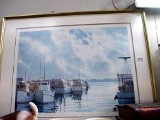 A framed and glazed print of a harbour scene