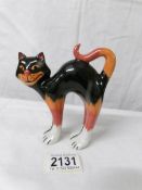 A Lorna Bailey orange and black cat with arched back, 14 cm.