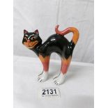 A Lorna Bailey orange and black cat with arched back, 14 cm.