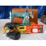 An Alfa model 50 electric sewing machine with case and accessories.
