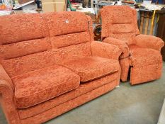 A salmon 2 seat settee and recliner