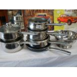 A set of 6 stainless steel pans a Teflon frying pan etc