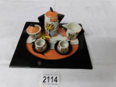 A Lorna Bailey miniature tea set on tray entitled 'Beach'.