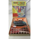 A Show a Slide battery operated projector with 84 colour slides showing 12 complete stories of