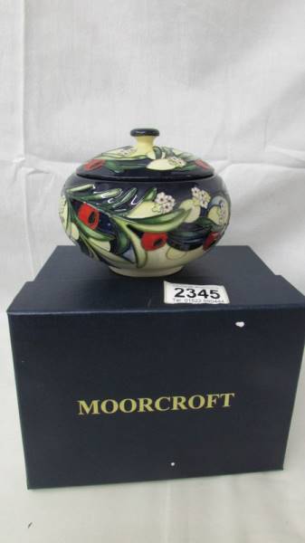 A limited edition Moorcroft lidded pot, signed, 2/40.
